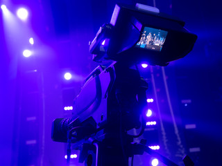 Fototapeta na wymiar tv camera in a concert hall. Digital TV camera.