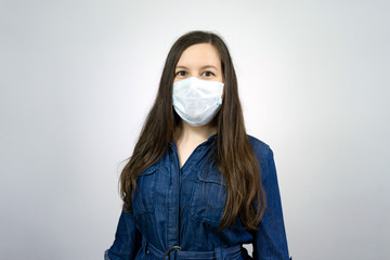 Woman wear protective face mask at home - protection against influenza virus.. Stop the virus and...
