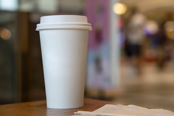Mock-up of without Cup sleeve White paper hot coffee cup in Coffee shop./Food packaging pattern.