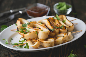 Grilled squid rings on a skewer