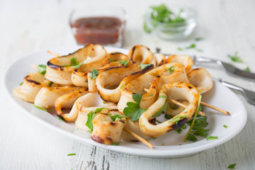 Grilled squid rings on a skewer