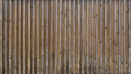 Old boards, a wooden peeled wall of brown color