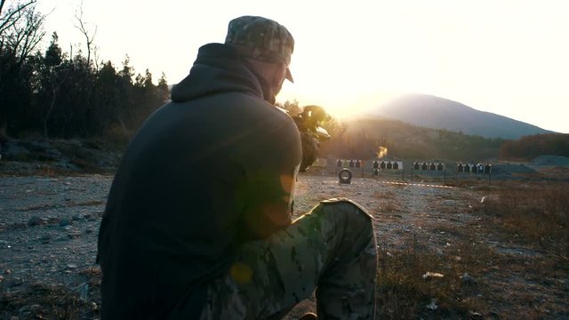 Specialist from the special forces unit fires at a military training ground from a rifle