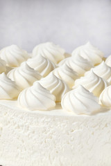 Creamy peaks of cream for the cake. Close up