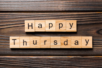 Happy thursday word written on wood block. Happy thursday text on wooden table for your desing, concept