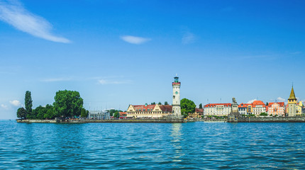 View of the Lindau embankment from the lake. The New lighthouse, the Bavarian lion and the Mangturm...