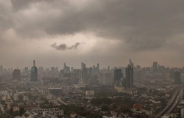 Fototapeta na wymiar Dark clouds before a rain are falling in the city.
