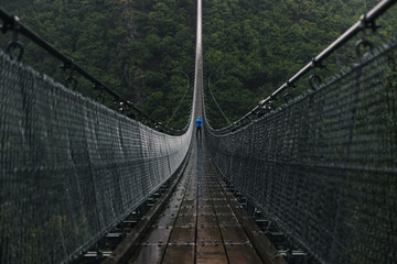 Huge Hanging Rope Bridge in Rain
