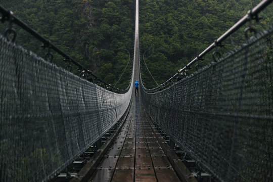 Fototapeta Huge Hanging Rope Bridge in Rain