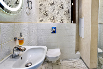 Interior of a modern bathroom with a sink and toilet