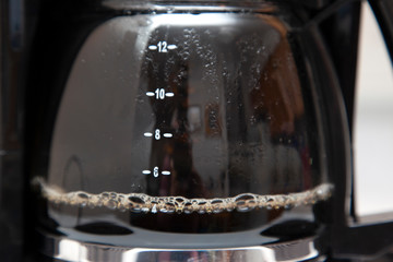close view of coffee brewing in a pot
