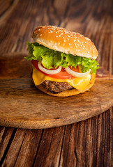 homemade hamburger on a wooden board. 