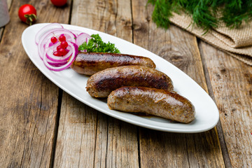 beef kupaty on wooden table