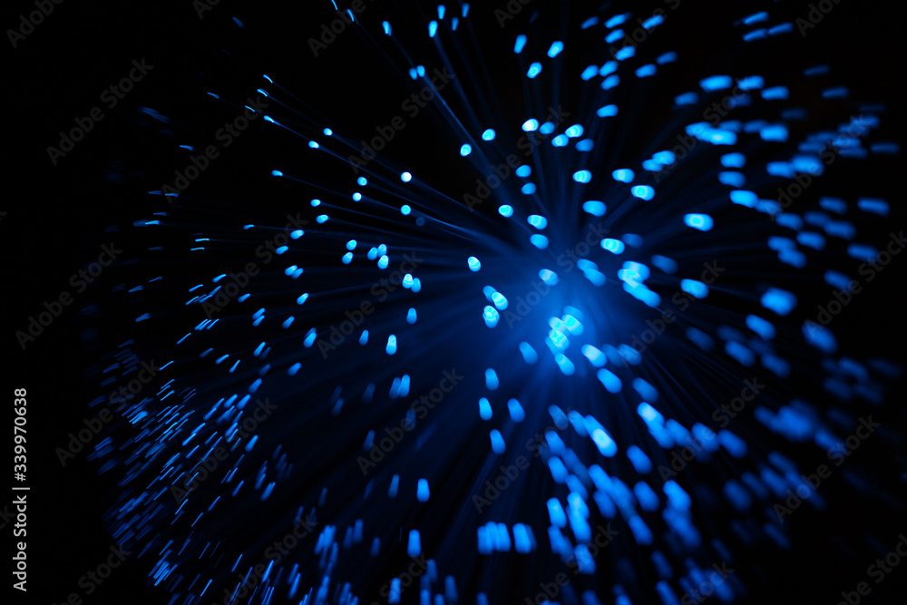 Wall mural blue abstract particles and lines with bokeh and blur in dark background
