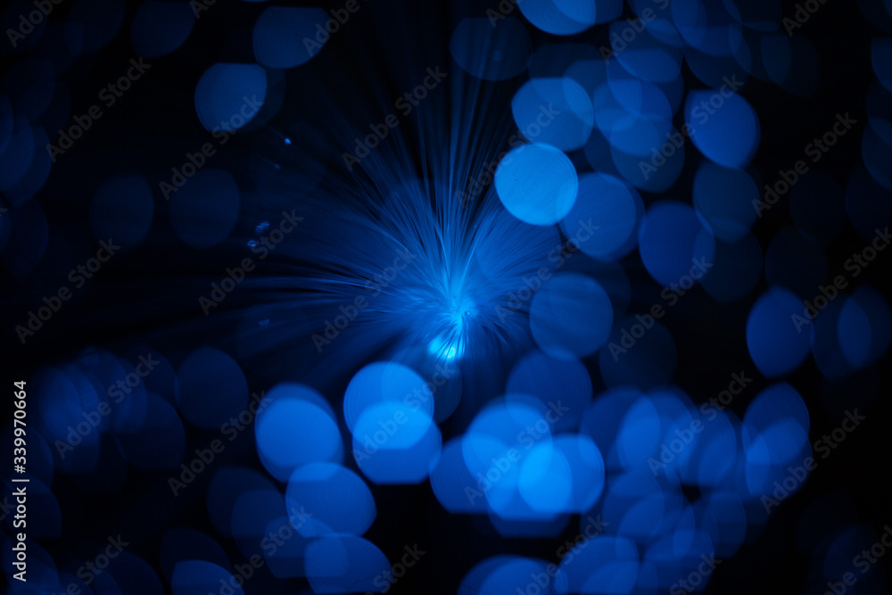Wall mural blue abstract particles and lines with bokeh and blur in dark background