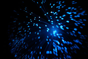 Blue abstract particles and lines with bokeh and blur in dark background