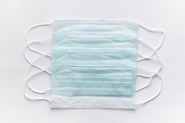 set of medical masks of different colors on a white background