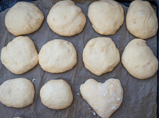 Fototapeta na wymiar Bread dough on floured board waiting to rise. ,making bread rolls at home.