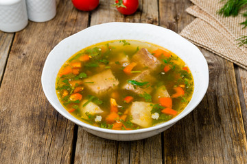 Khashlama with lamb on wooden table