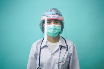Asian woman doctor wearing protection Suit for Fighting Covid-19 or coronavirus.