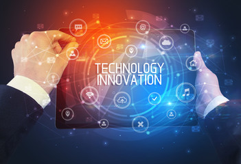 Close-up of a tablet with TECHNOLOGY INNOVATION inscription, innovative technology concept