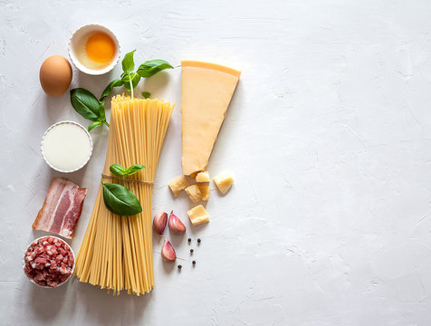 Fresh raw ingredients for traditional italian pasta Carbonara. Top view, copy space