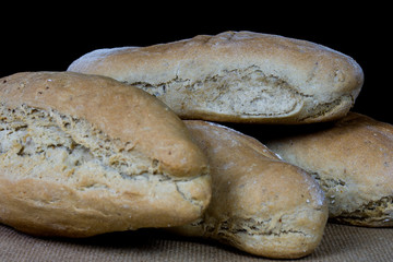 homemade bread on black background