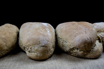 homemade bread on black background