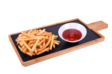 French fries with ketchup on a wooden board isolated on a white background.