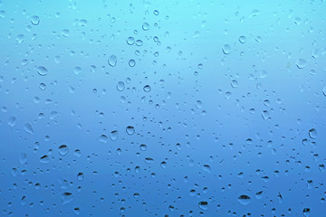 Raindrops water drop on window glass,