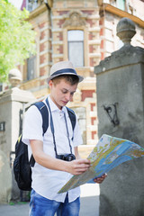 young tourist with map in hand