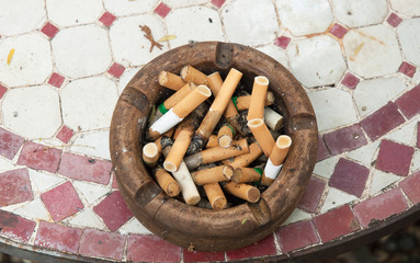 Ashtray full of extinguished cigarette butts