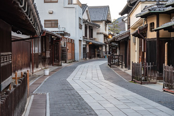 Takehara Townscape Conservation Area in dusk. The streets lined with old buildings from Edo, Meiji periods, a popular tourist attractions in Takehara city, Hiroshima Prefecture, Japan