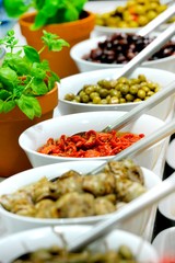 Awesome tasty of Assorted pickles with different types of olives - Close up