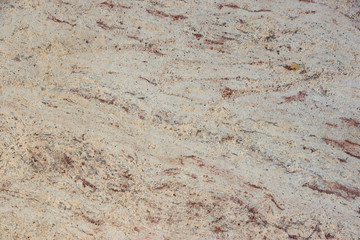 Background natural granite, beige with red dots, called Ivory Brown