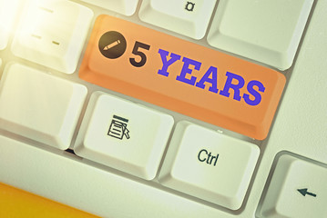 Conceptual hand writing showing 5 Years. Concept meaning Remembering or honoring special day for...