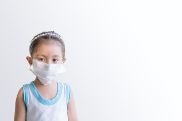A girl wearing a mask to protect the COVID-19 virus.