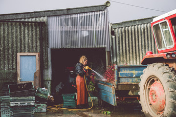 Female Farmer washing her beetroot crop