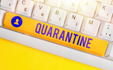 Conceptual hand writing showing Quarantine. Concept meaning restraint upon activities of...