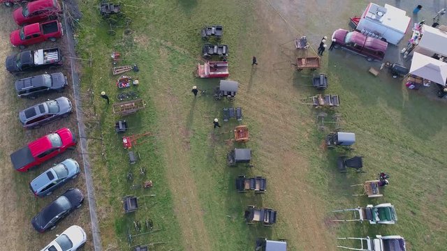 Downward Aerial of an Early Morning View of Opening Day at an Amish Mud Sale Selling Farm Equipment to Quilts
