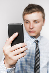 Business executive texting on his cell phone