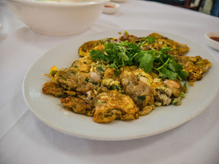 Chinese oyster omelette in Chinese Restaurant at lufeng city Guangdong province China.