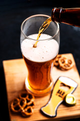 amber beer pouring in glass 