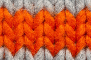 Colorful knit sweater texture macro. Empty copy space background with saturated sweater. Hobby...