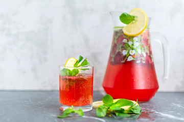 homemade lemonade with strawberries, mint and lemon, jug and glass with summer refreshing cocktail