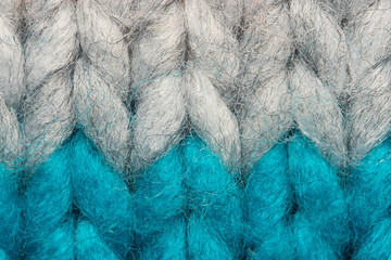 Colorful knit sweater texture macro. Empty copy space background with saturated sweater. Hobby...