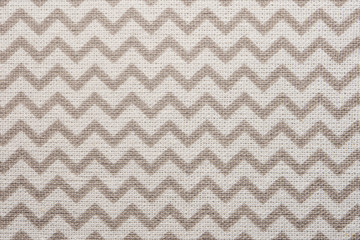 Pattern of gray and white striped zig zag. Macro textile texture