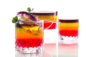 Fototapeta na wymiar Sweet multi-colored fruit puff jelly in a glass cup
