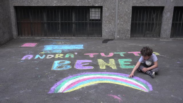 Europe, Italy , Milan  -  Italian children and parents draw  the inscription everything will be fine ( tutto andra' bene )during n-cov19 Coronavirus epidemic - quarantine life style - flash mob