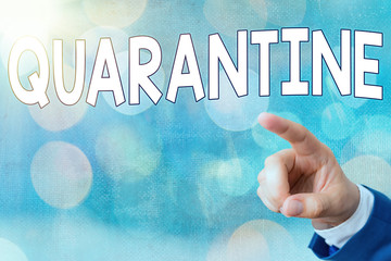 Writing note showing Quarantine. Business concept for restraint upon activities of individuals or...